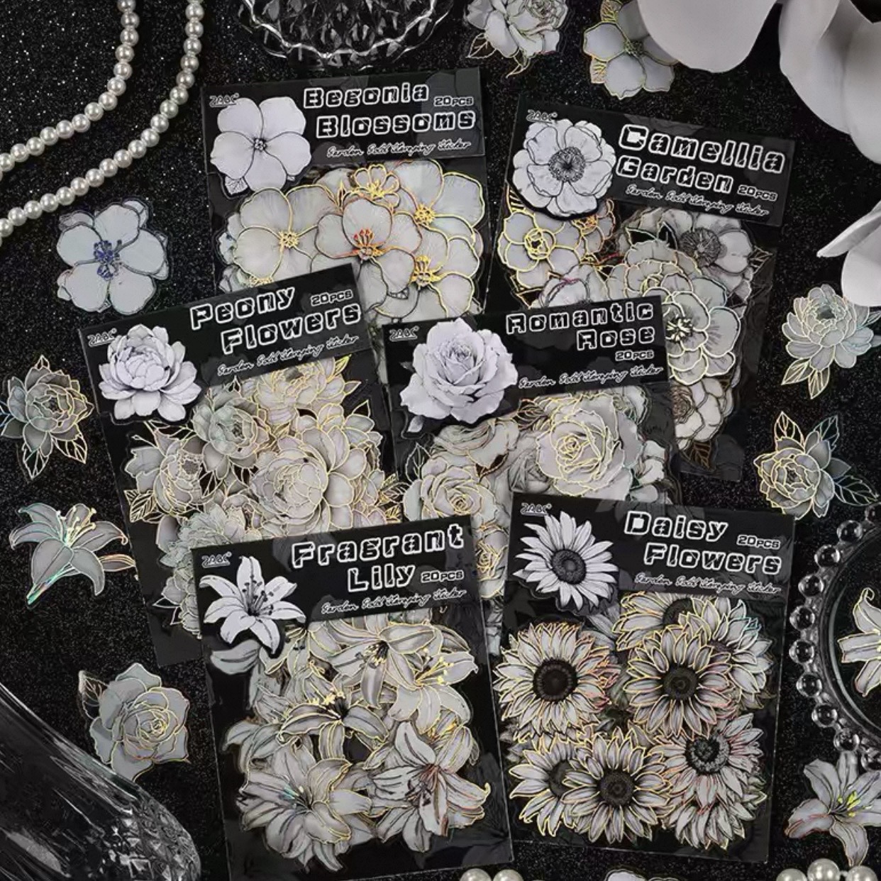 Close view of white floral custom stickers with individual die-cut shapes.